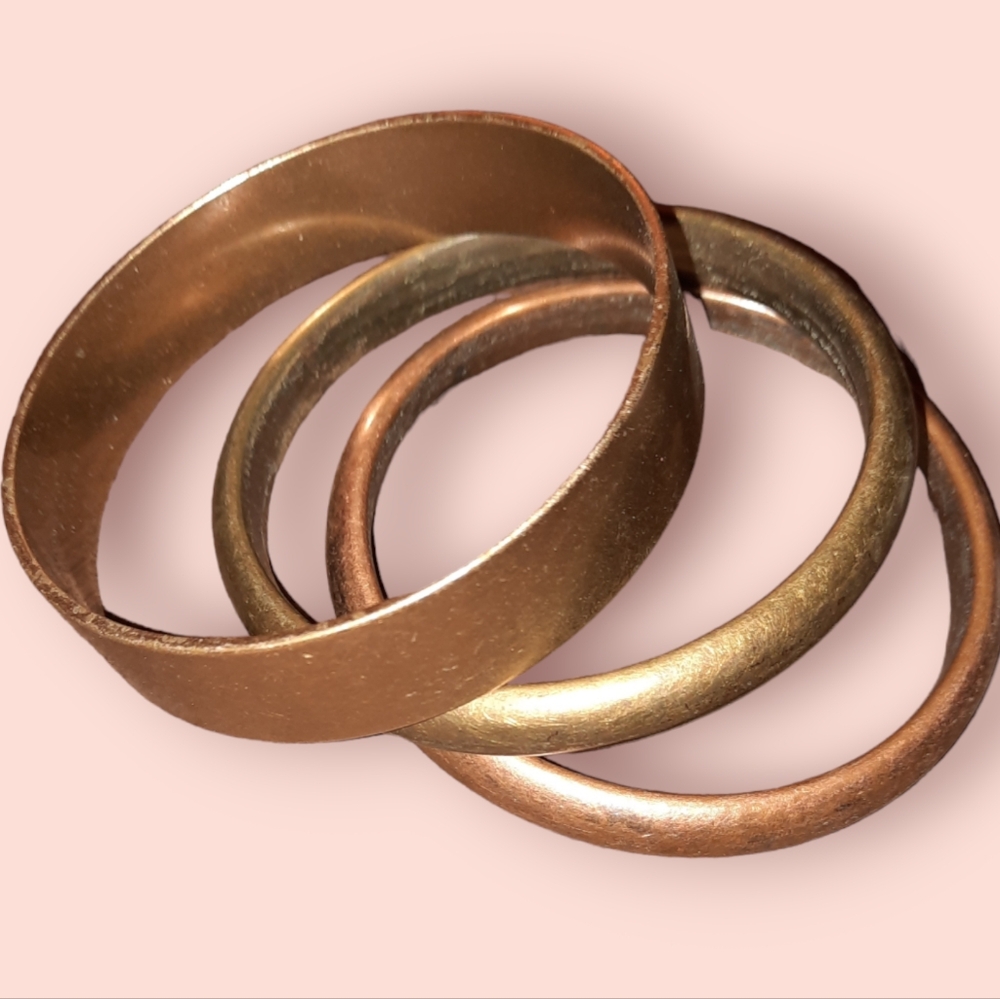 Three bangle bracelets in golden and earth tones